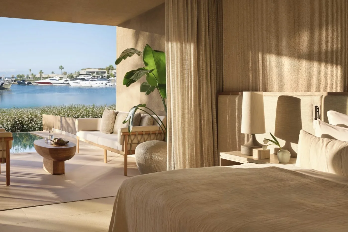 Bedroom in a grand residence at Sani Asterias opening onto a terrace, an infinity pool and Sani Marina