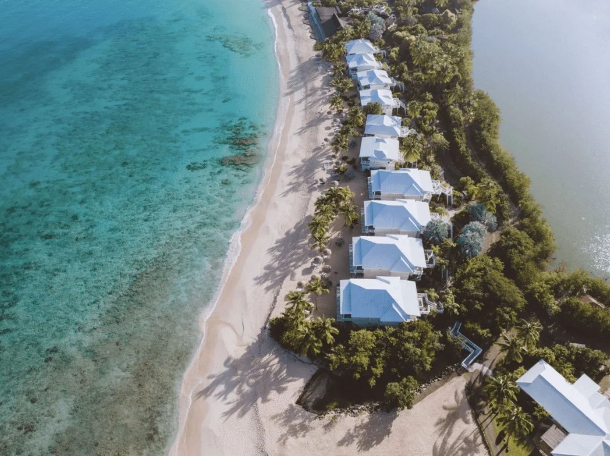 Aerial view of the beachfront rooms and turquoise sea