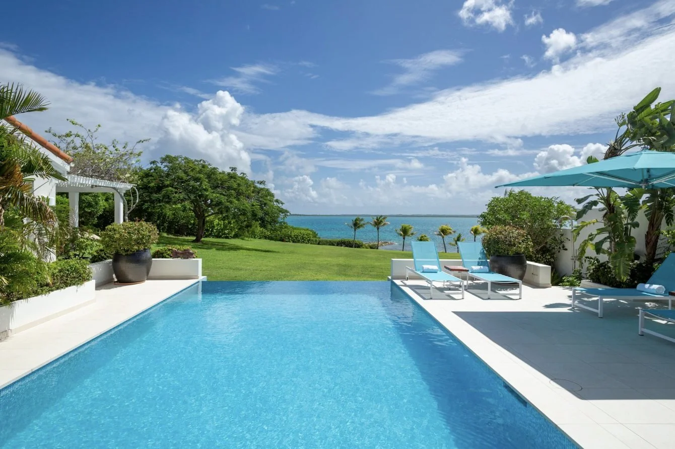 A villa infinity pool looking out to sea