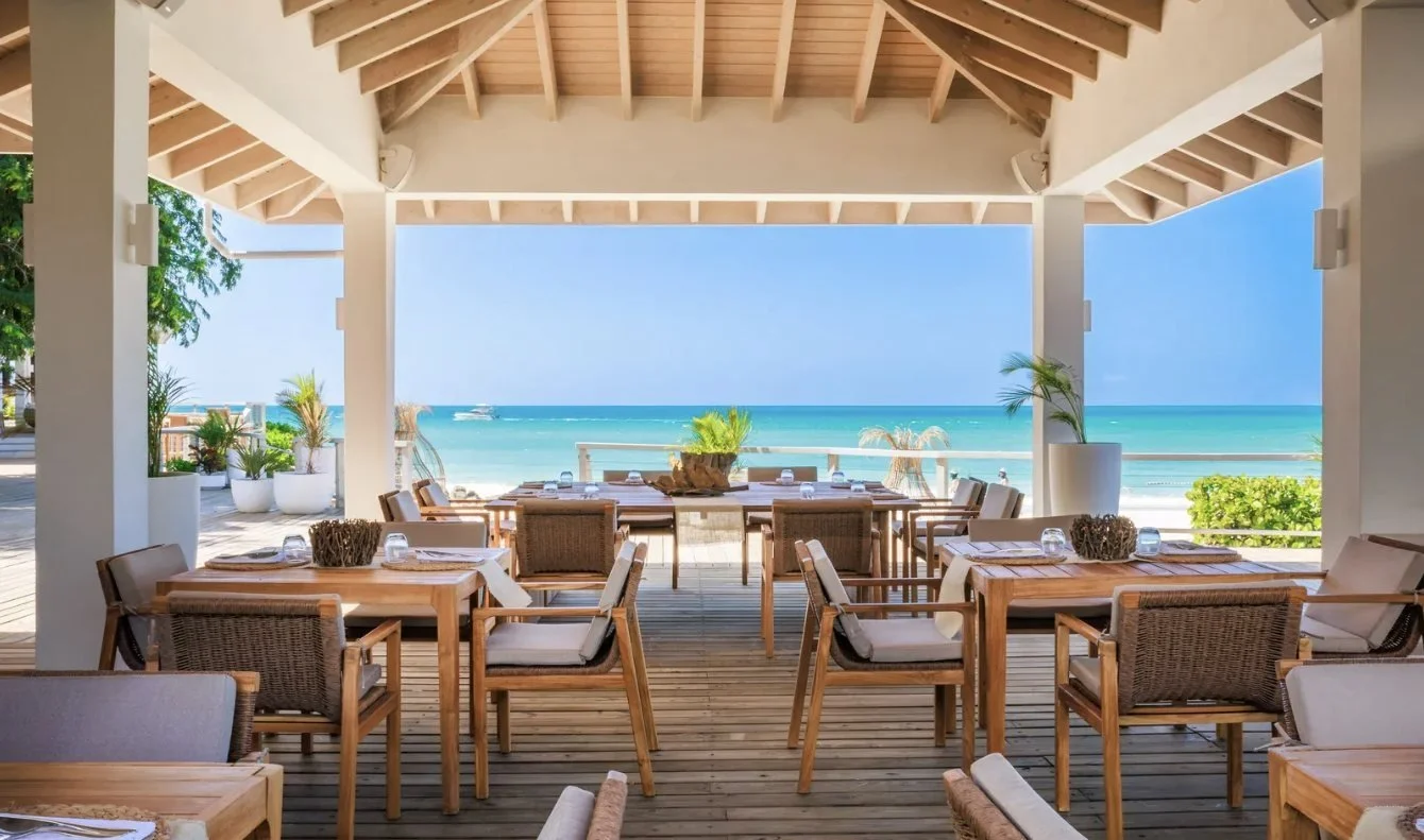 An open-air dining pavilion with sea views