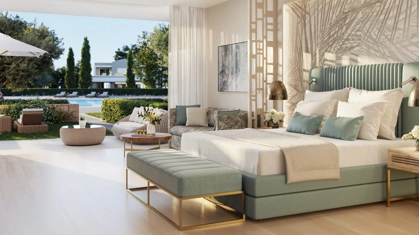 A Junior Suite Private Garden opening onto a garden terrace with wicker seats, with the pool beyond the hedge
