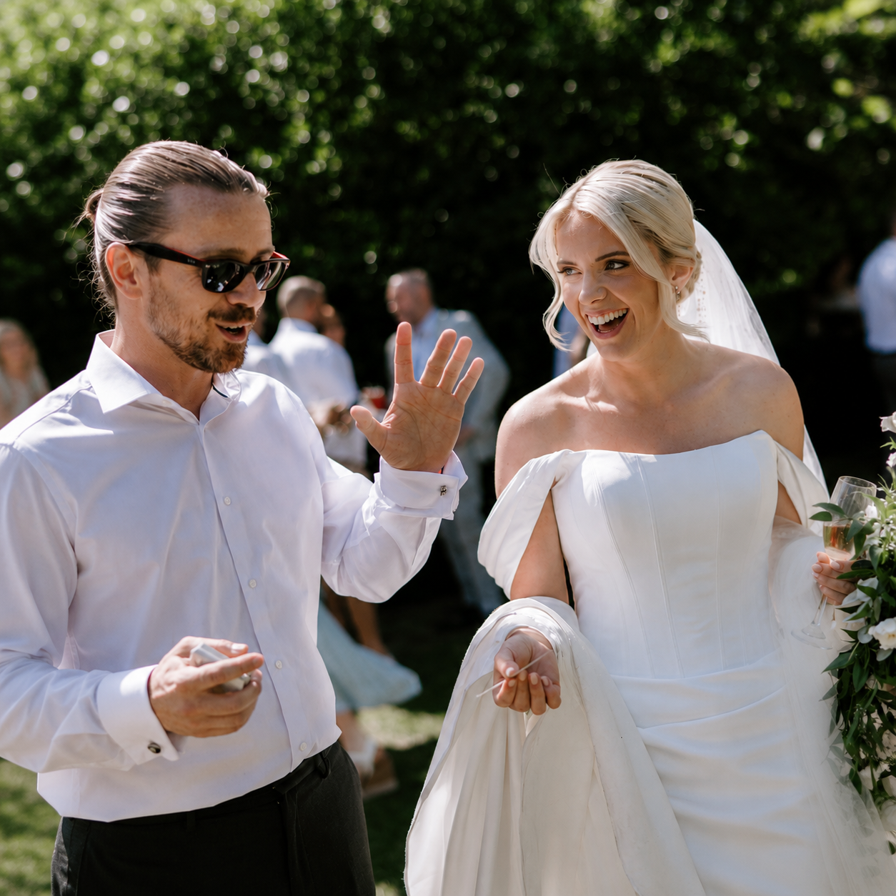 A bride and groom sharing a moment of surprise during wedding magic