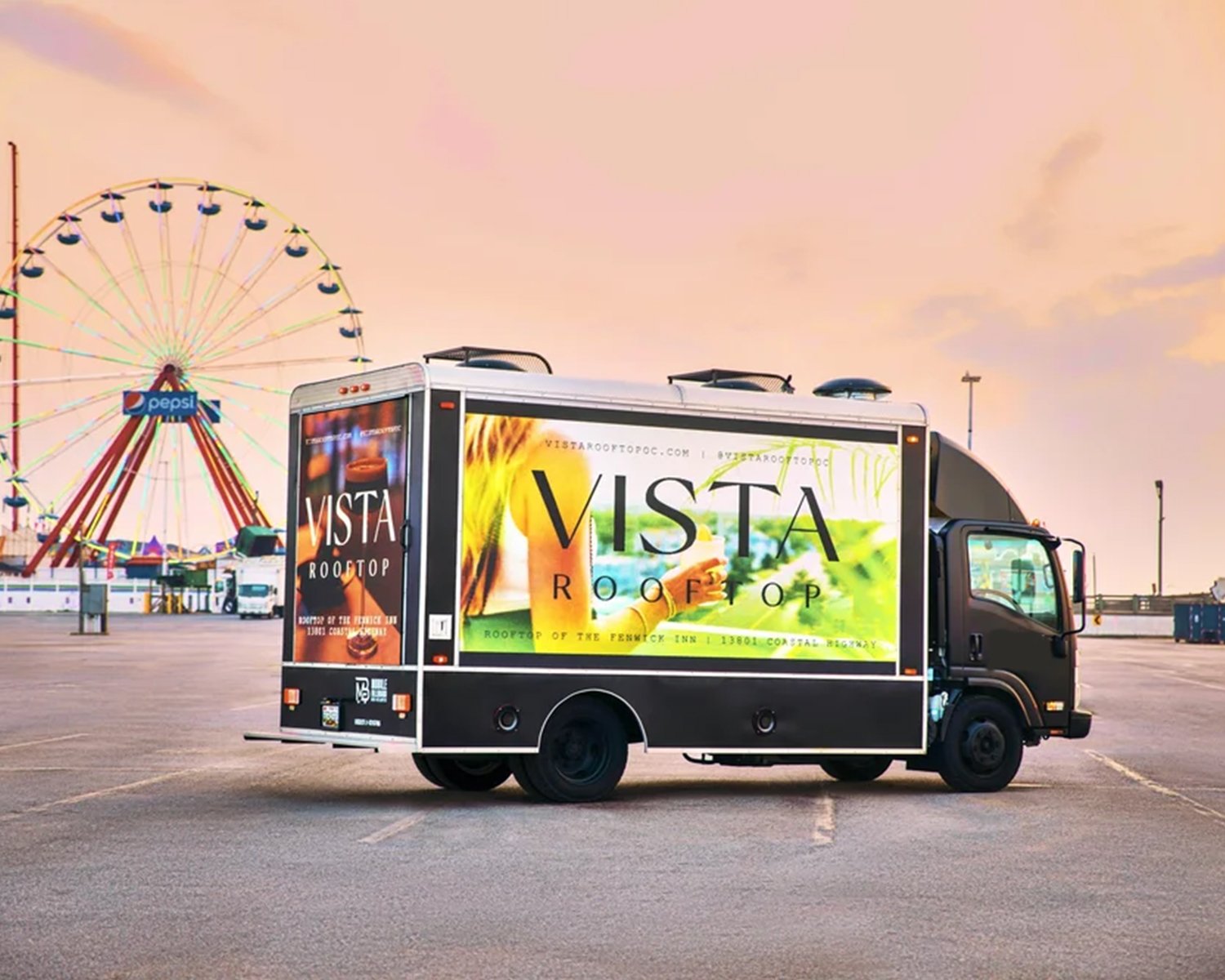 Three-sided LED billboard truck suited to pregame tailgate corridors around Hard Rock Stadium on Dolphins game days