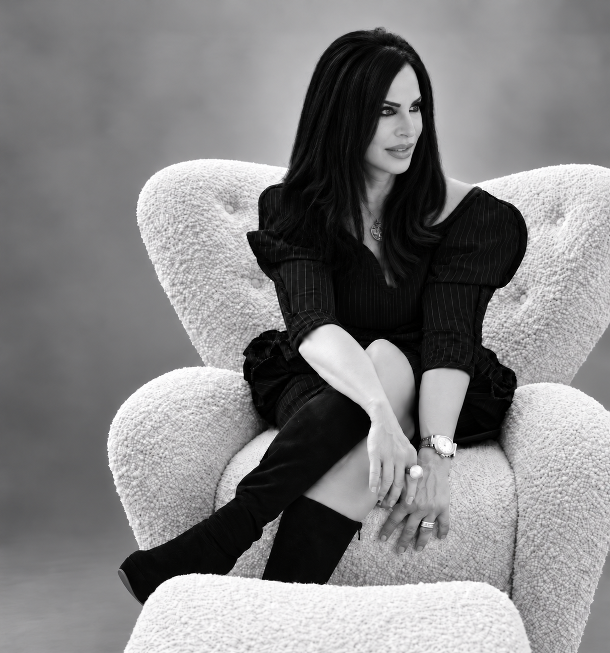 Suzi Yelvington seated in a white armchair