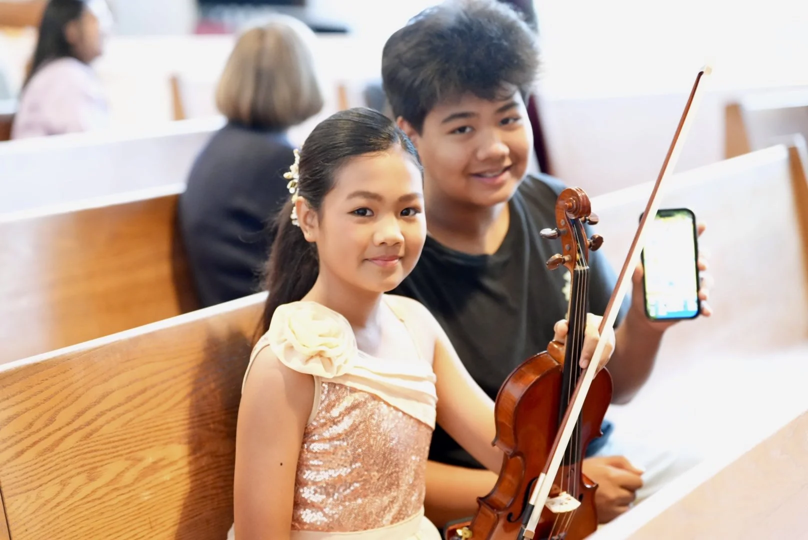 Two young students with a violin