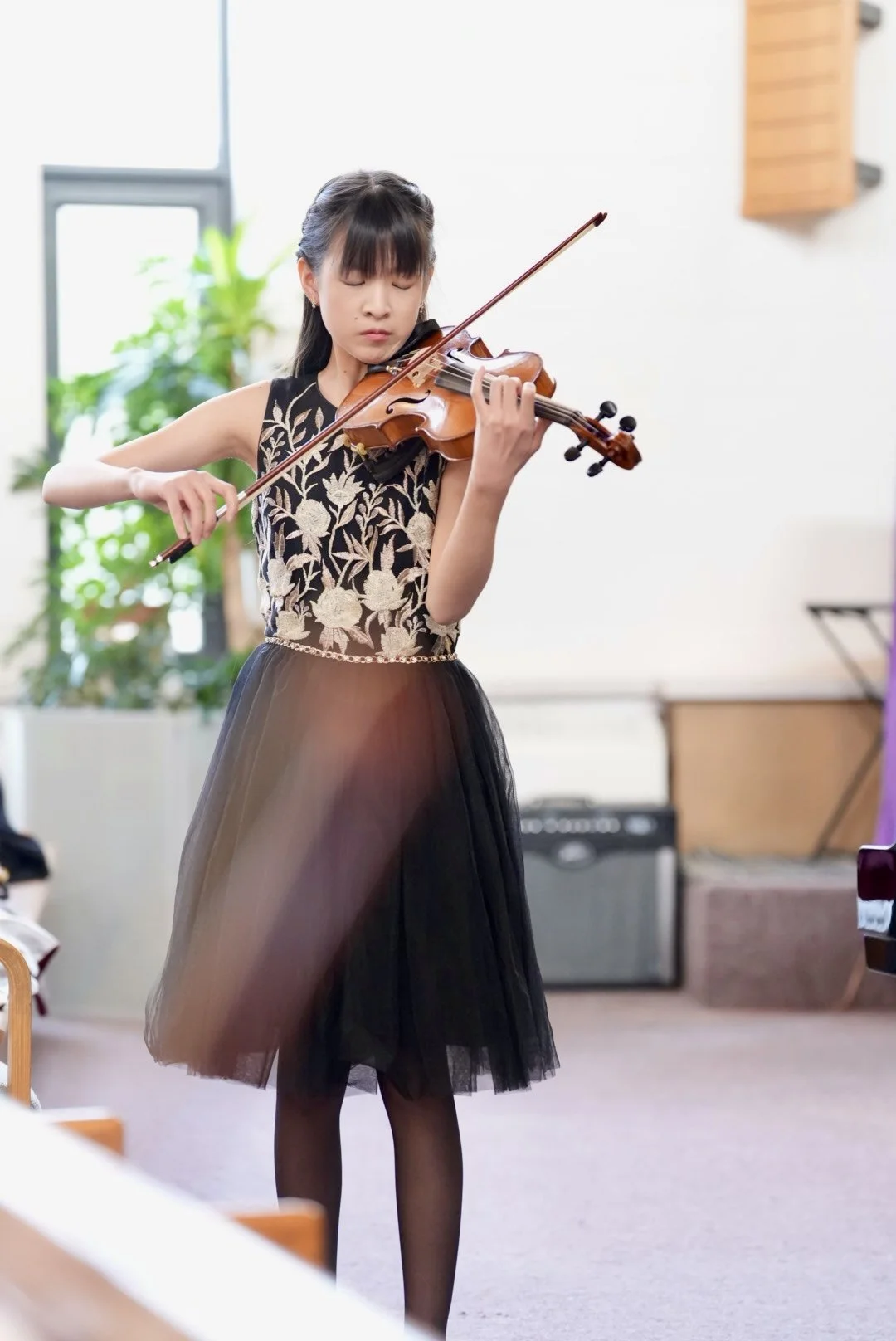 Violin student performing