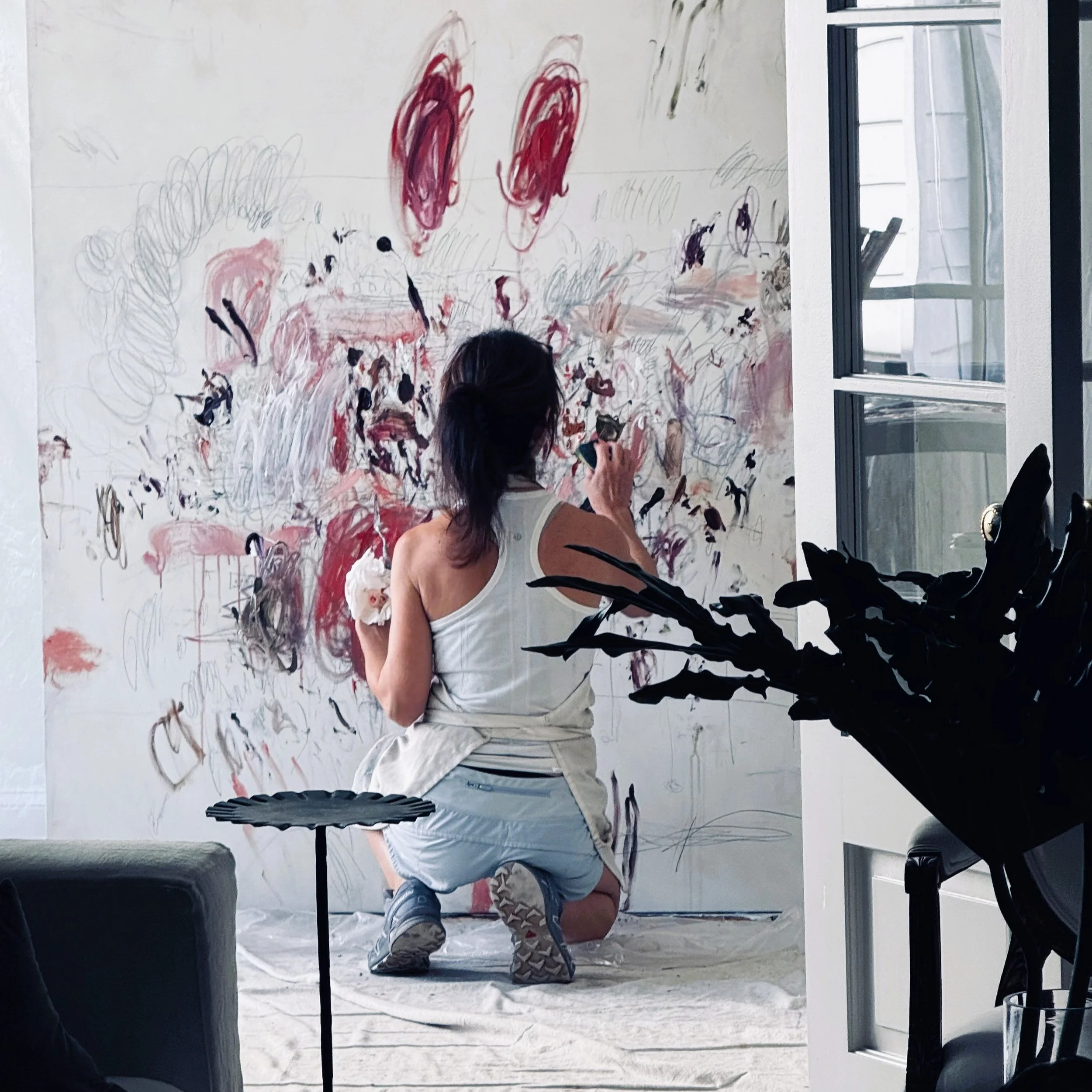 Karina Gentinetta painting in her studio