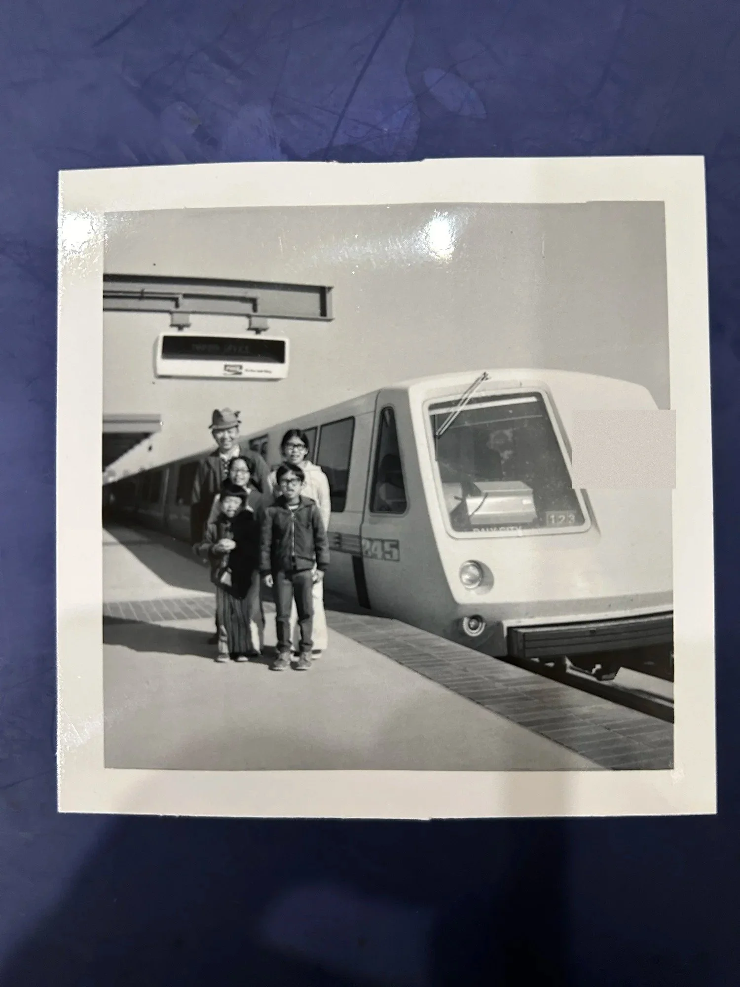 A young Laurance Lee with family at a BART station