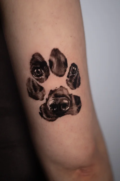 Dog in pawprint pet portrait tattoo