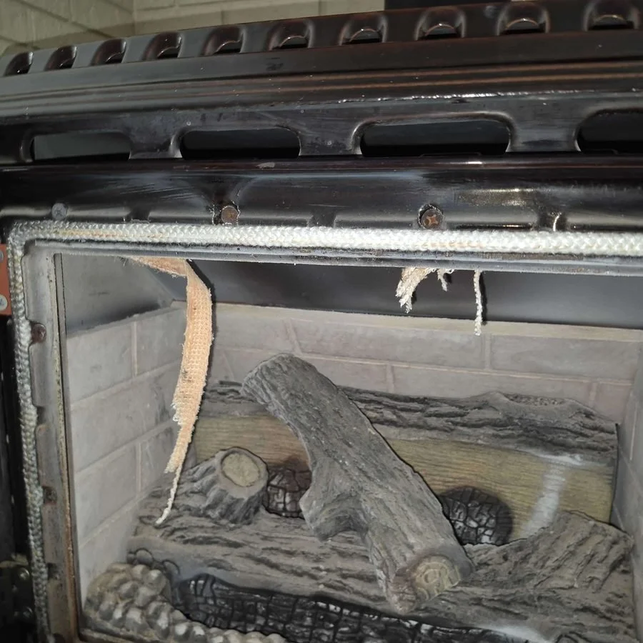 Torn gasket on a gas stove door, a safety risk