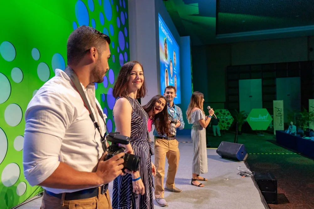 IT Roaming Reporters with their cameras on stage at the Cisco Live IT Management Program