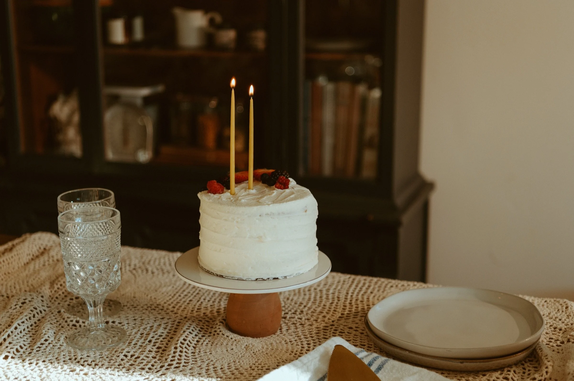 Birthday cake with two beeswax candles