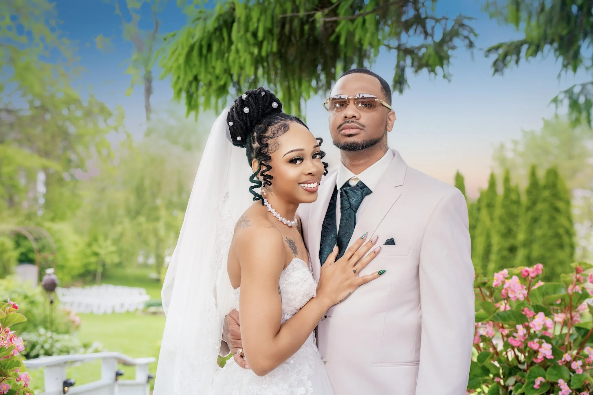 Bride and groom standing in a garden