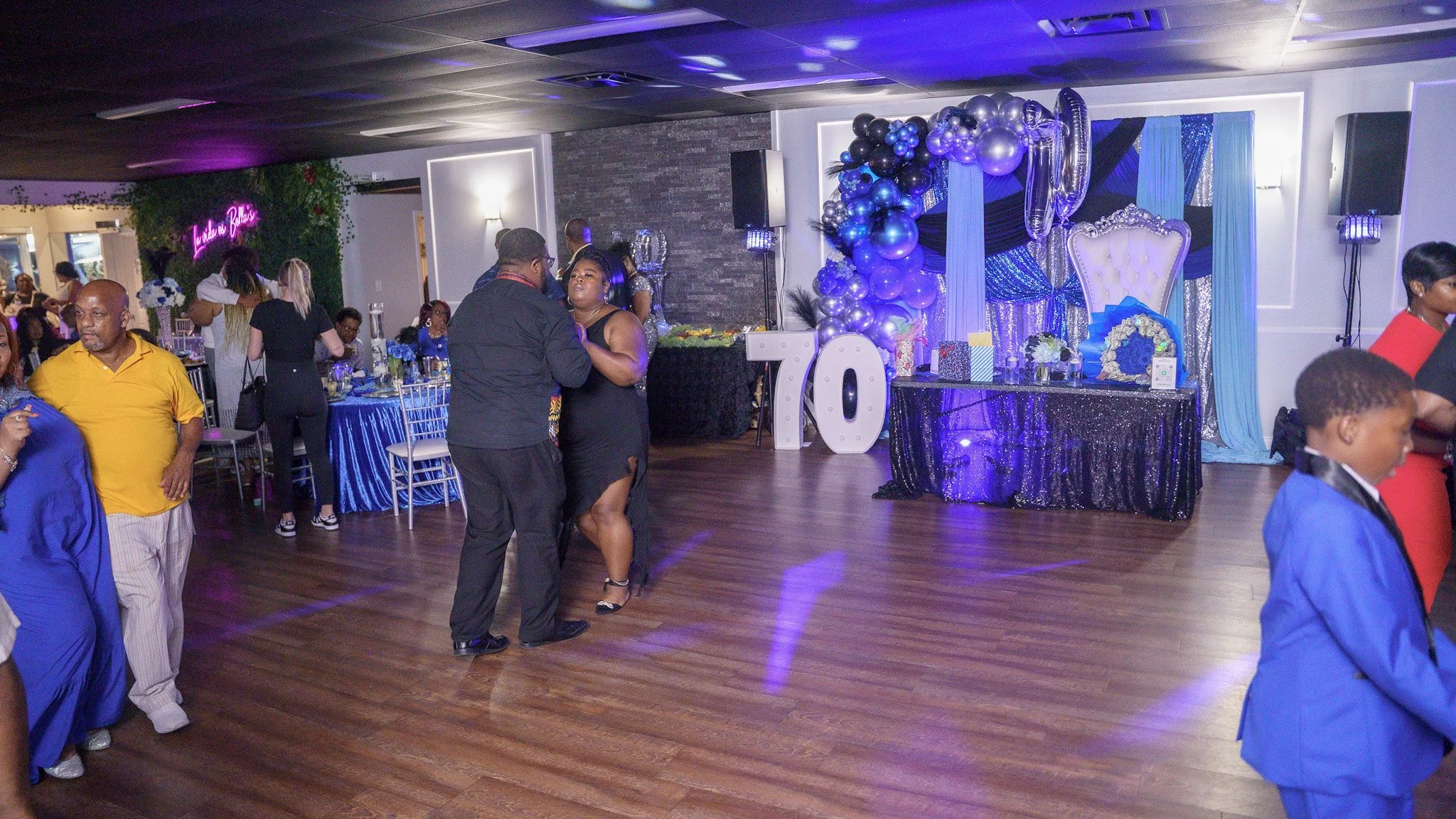 Guests dancing at 70th birthday party