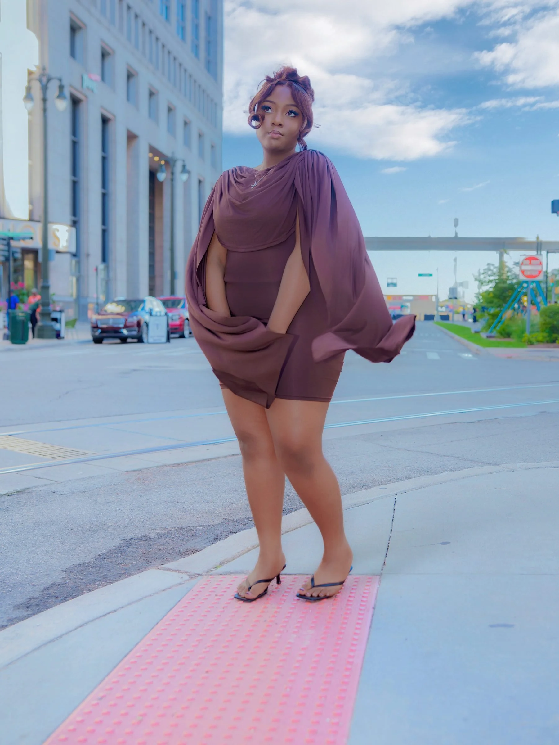 Portrait in purple dress, urban setting
