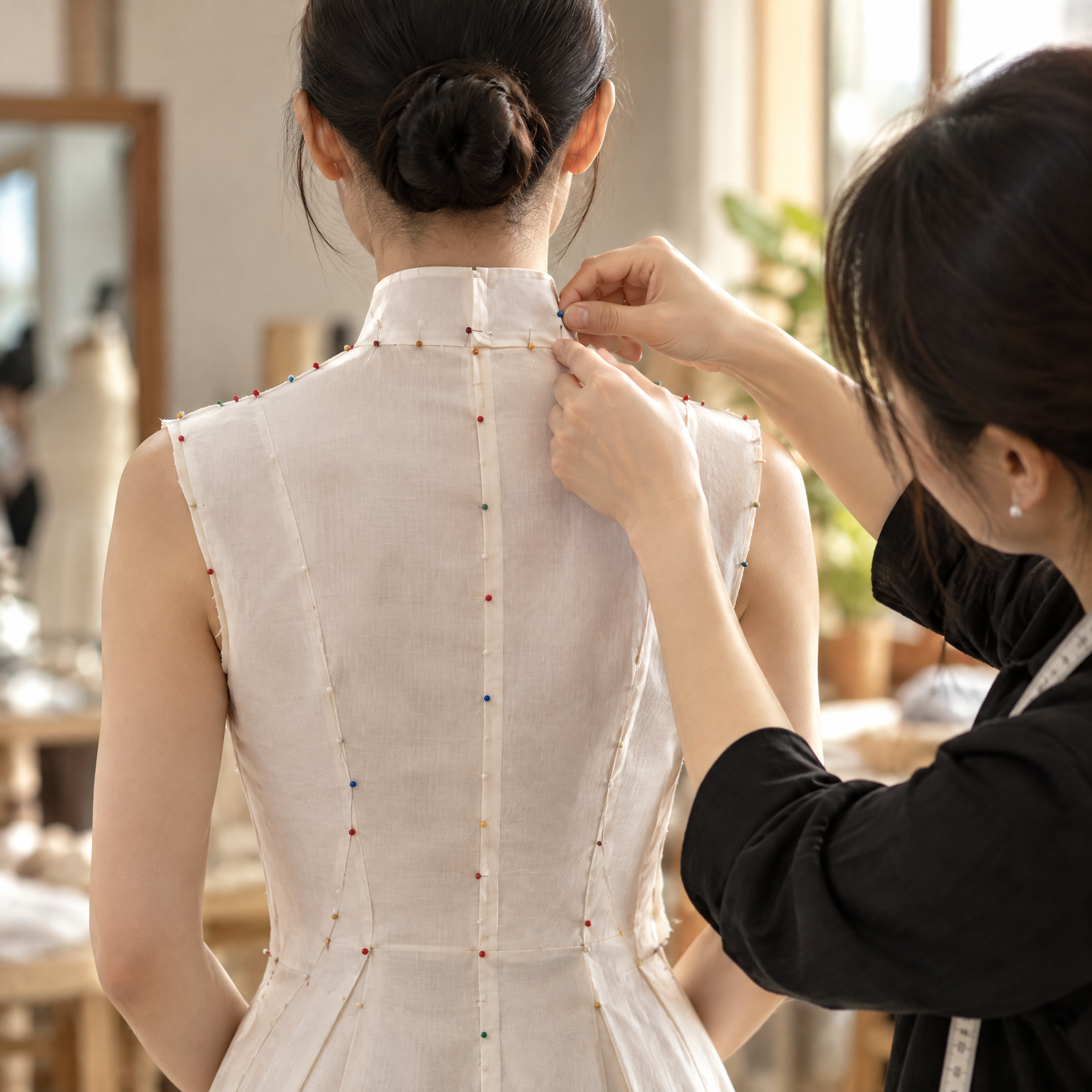 Pins refining the neckline, up close
