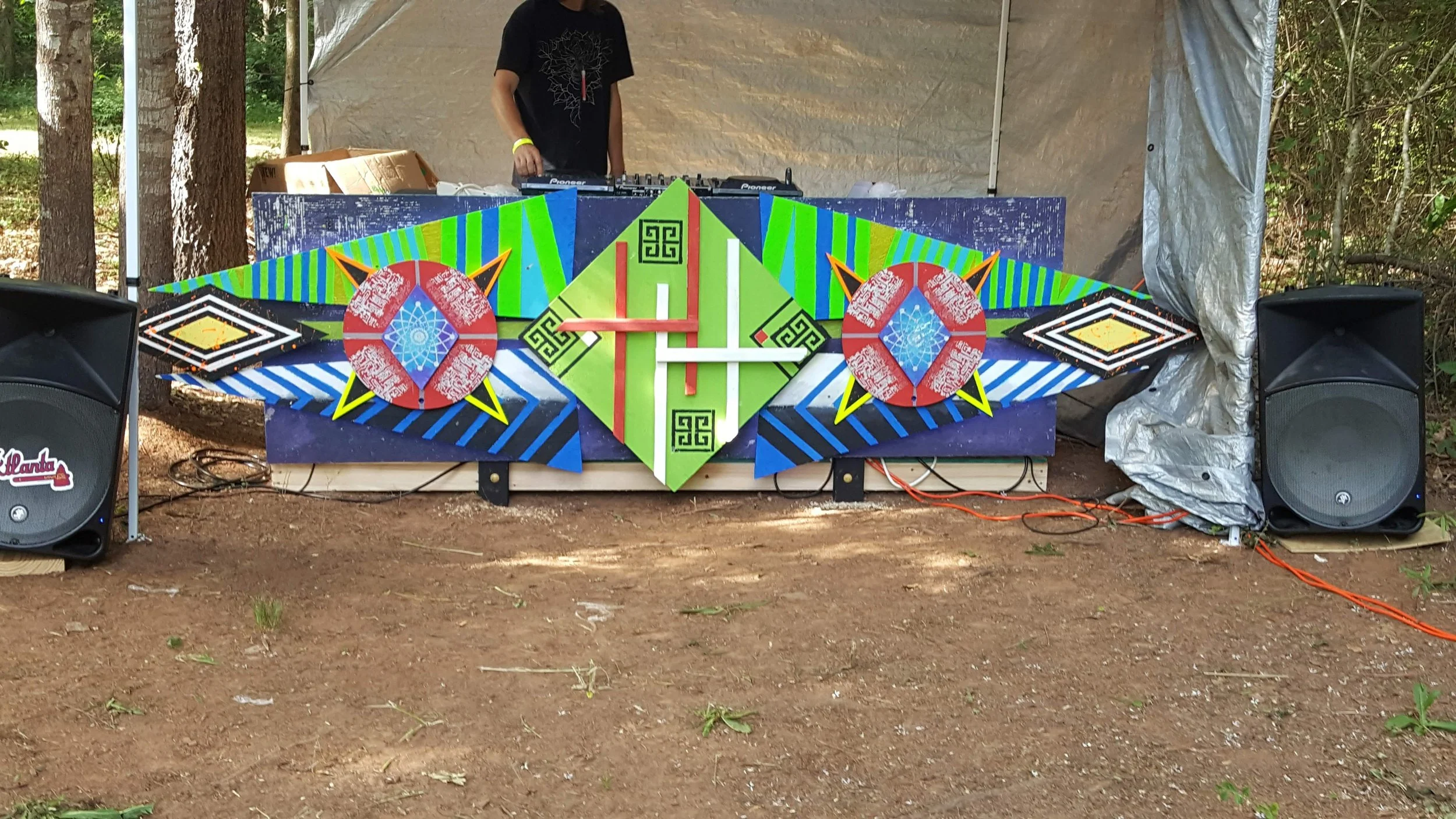 Geometric painted installation panels in an event tent