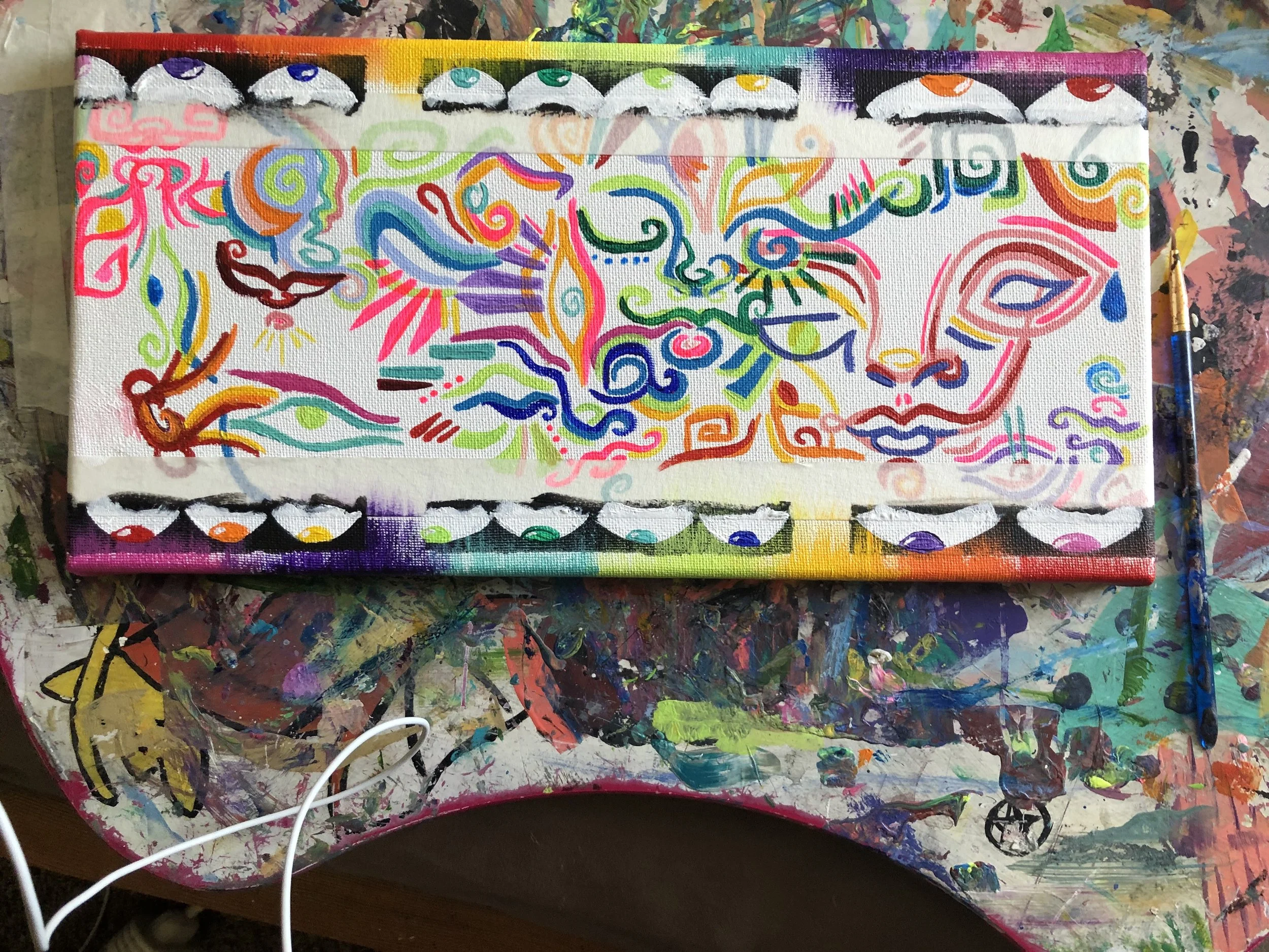 Colorful original artwork displayed outdoors