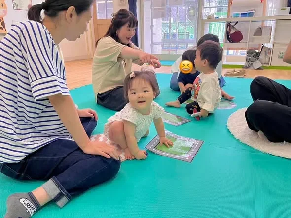 A smiling baby crawling