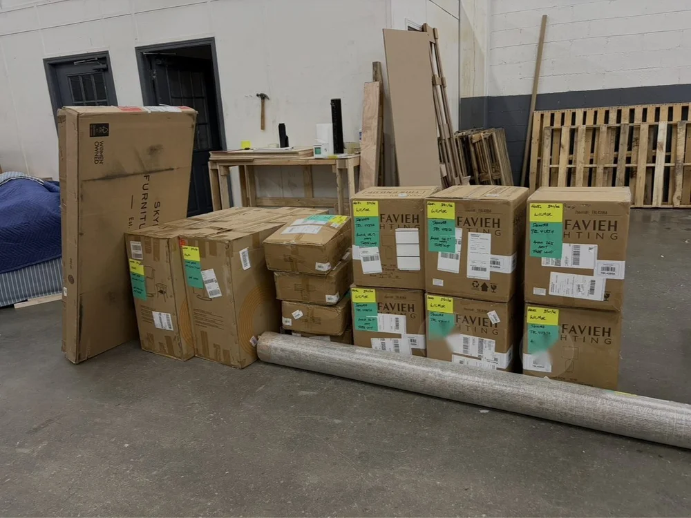 Tagged furniture deliveries staged in the SL2 receiving warehouse