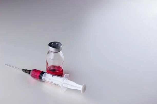 Syringe and vitamin vial