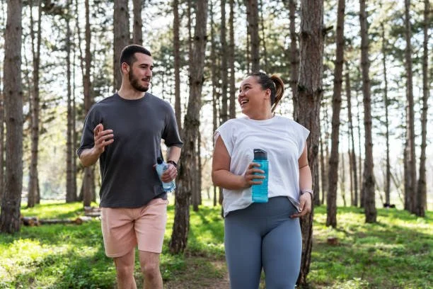 Two people walking outdoors