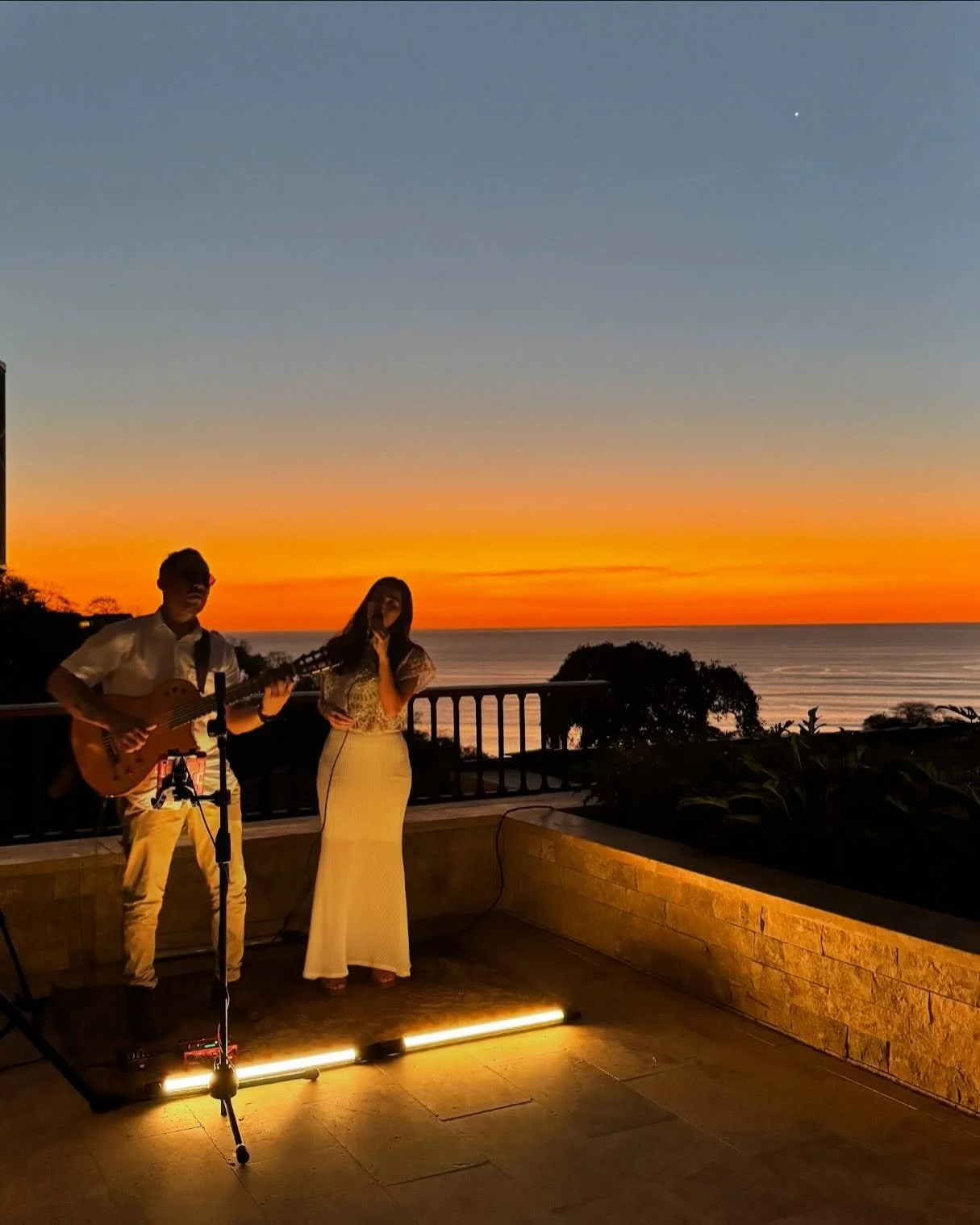 Marjo Valverde and guitar accompaniment at a private event at Casona Lawn, Nekajui