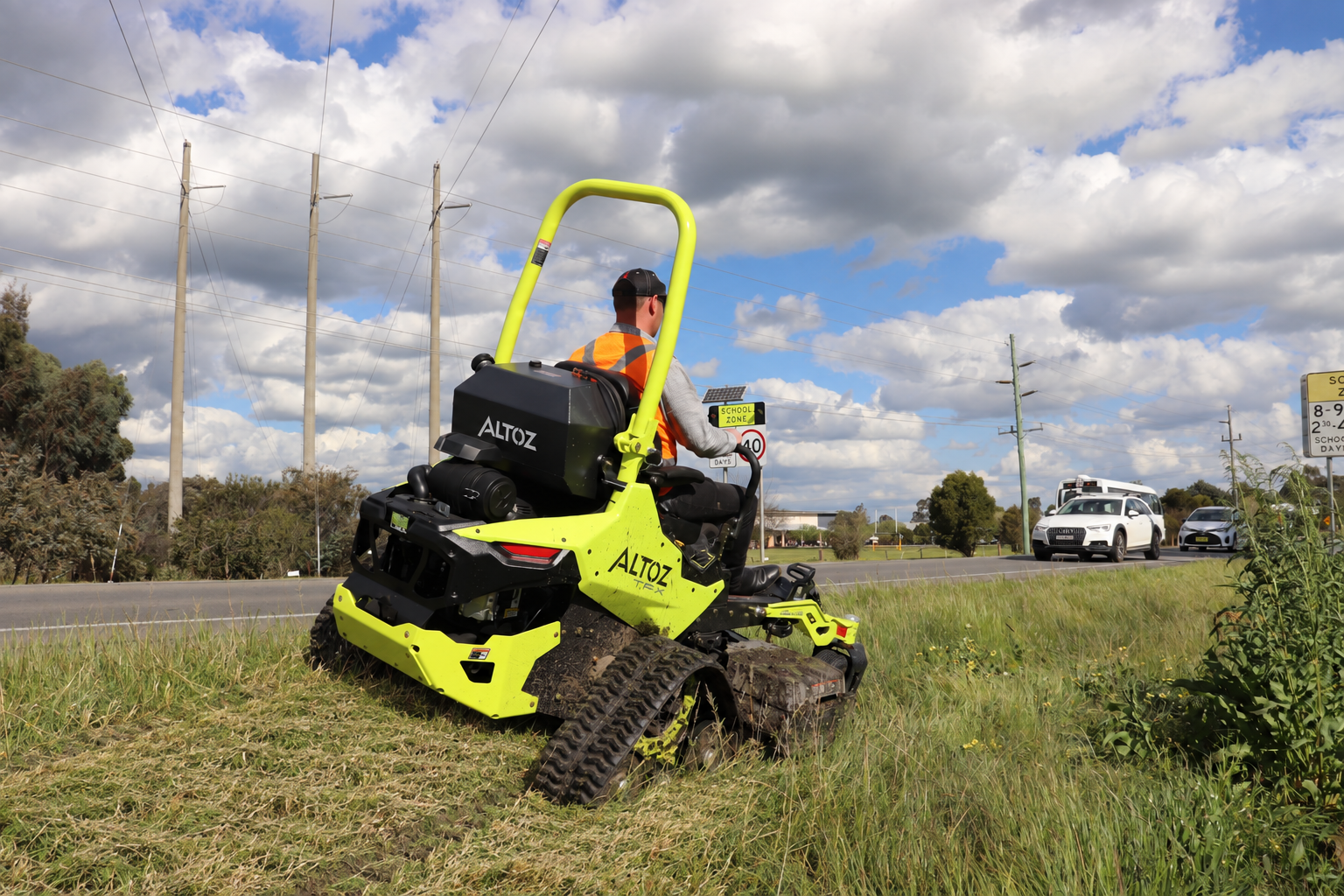 Altoz TFX 766 i tracked mower in high-visibility chartreuse on an Australian roadside
