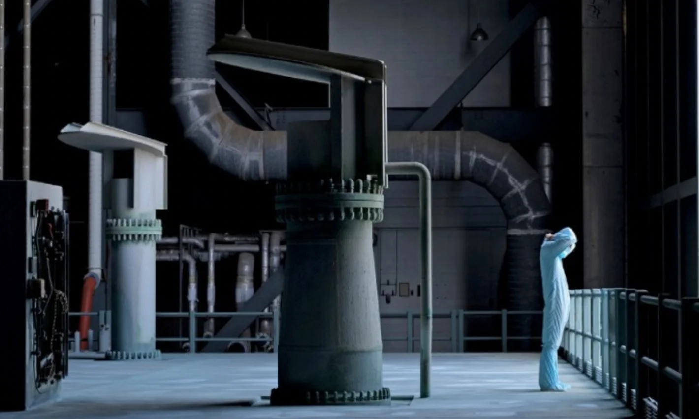 Industrial site with a scientist in a protective suit