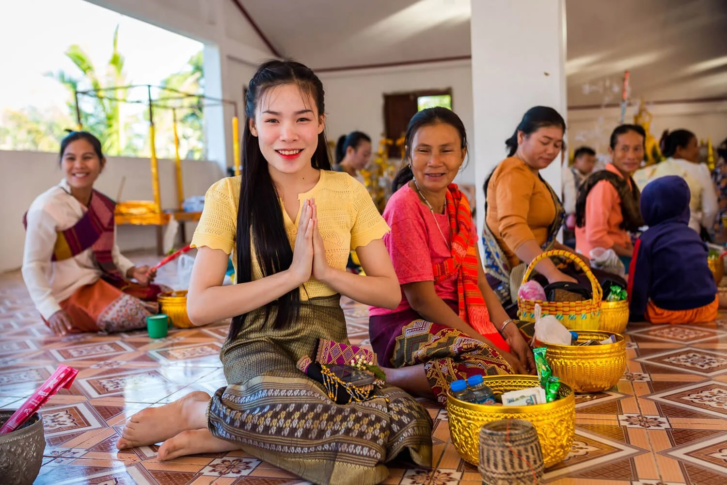 Young woman at a temple event near THPC base, Khammouane Province.