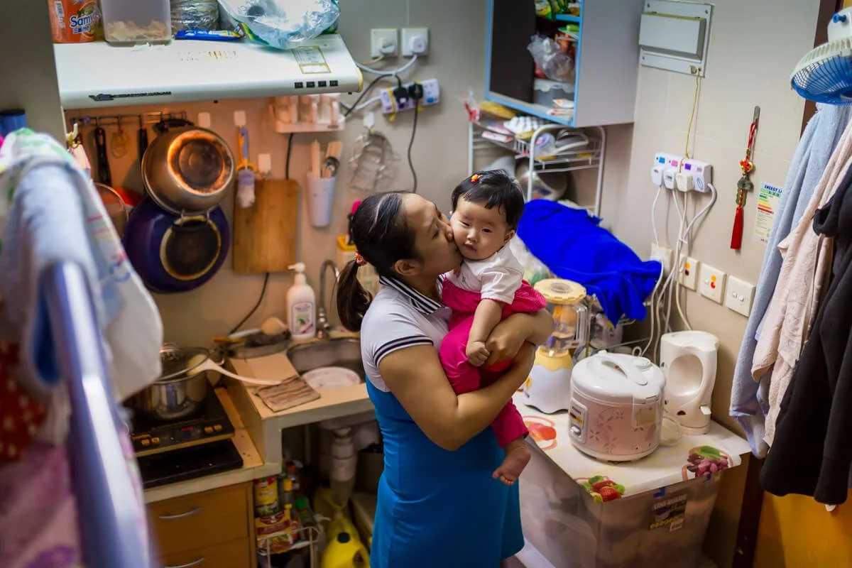 Mom and daughter in cramped Hong Kong apartment, for Pathfinders Hong Kong.