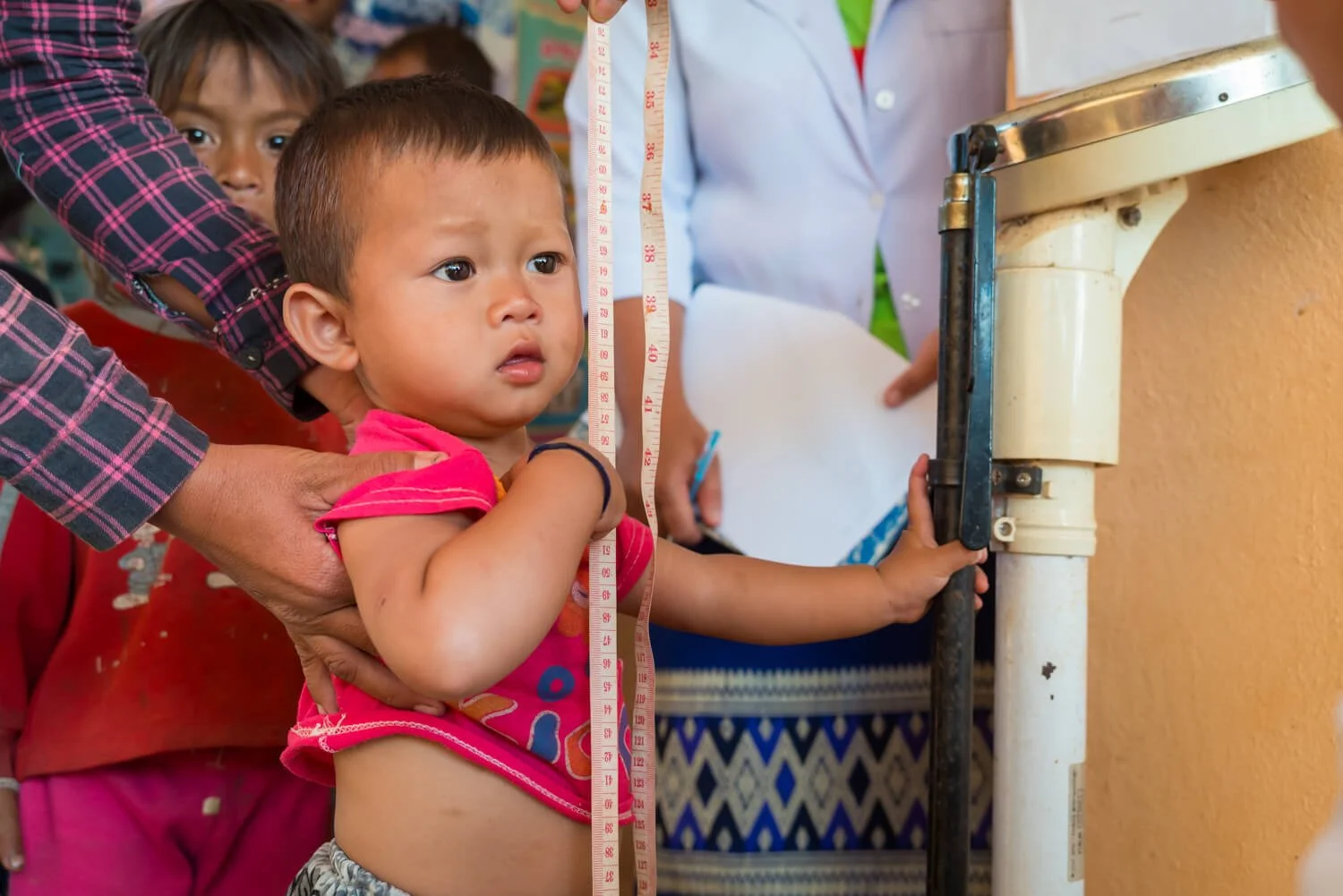 Public health documentary photo of infant in Laos