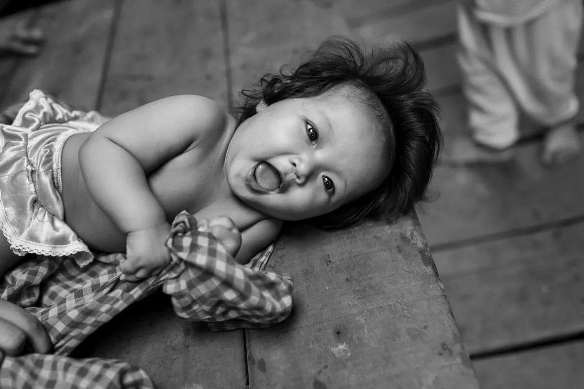 A young child in a Phnom Penh slum community affected by the HIV/AIDS crisis.