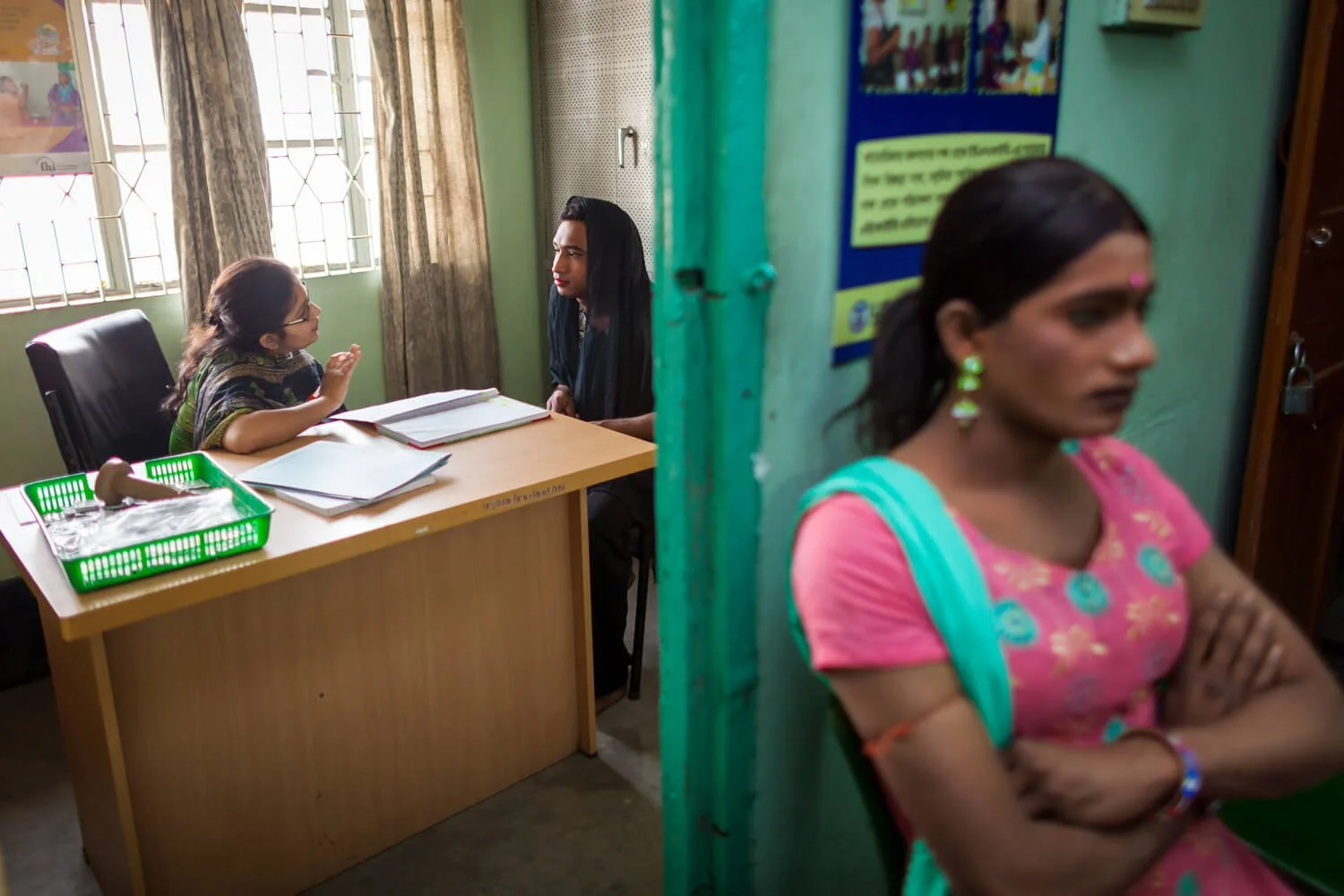 Hijra getting health advice at a clinic in Old Dhaka operated by FHI360 by Ian Taylor
