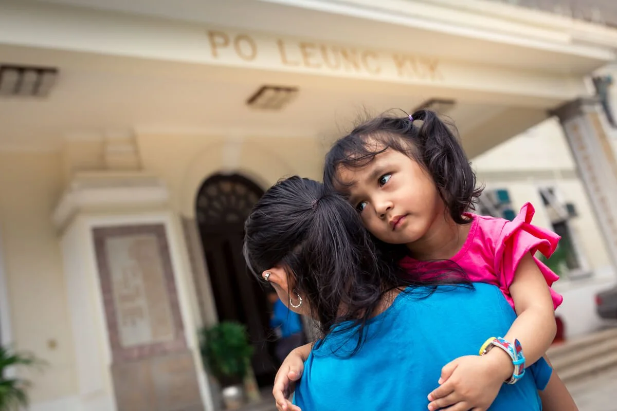 A young girl is returned to the Po Leung Kuk Orphange by her mom.