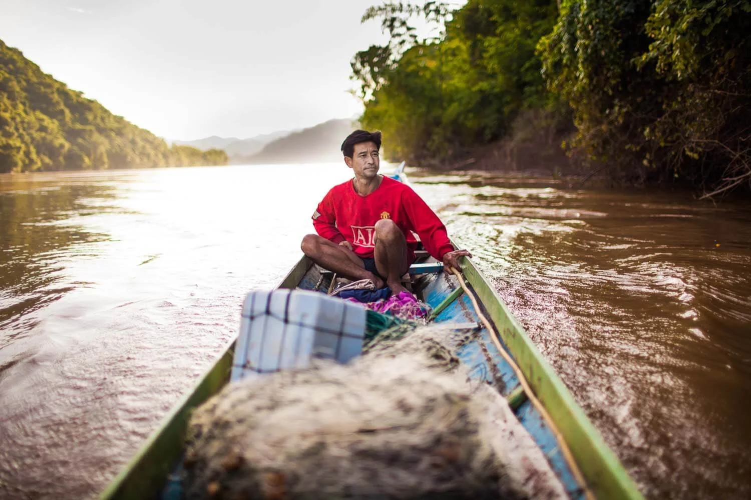 Downstream from Luang Prabang, Laos, a fisherman heads out to the Mekong River, for CGIAR.