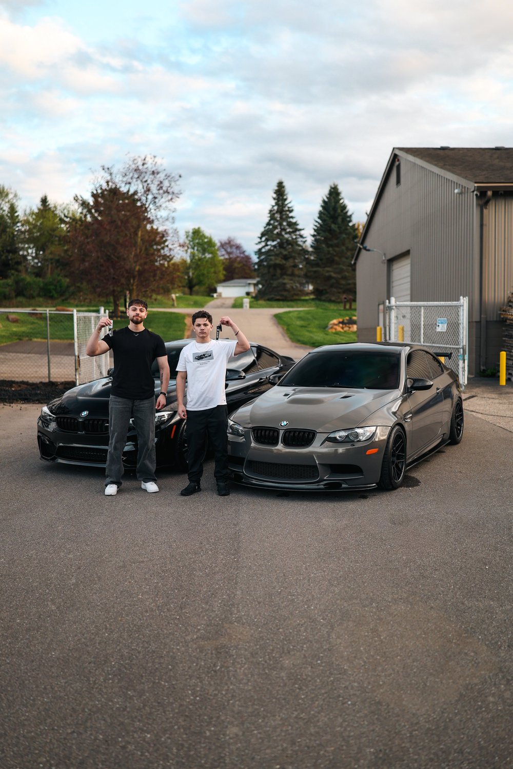David and Elias Alam, founders of Ascension Automotive, standing outside their climate-controlled Milford studio.