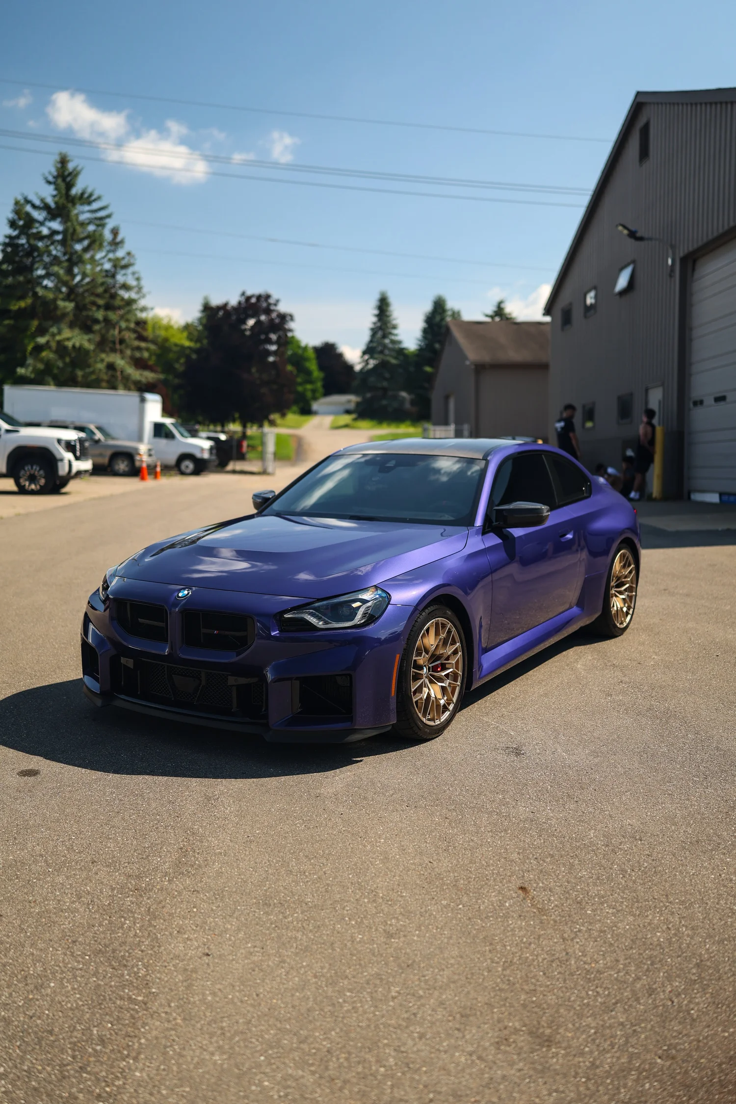 Purple BMW M2 with a ceramic coated finish outside the Ascension Automotive studio