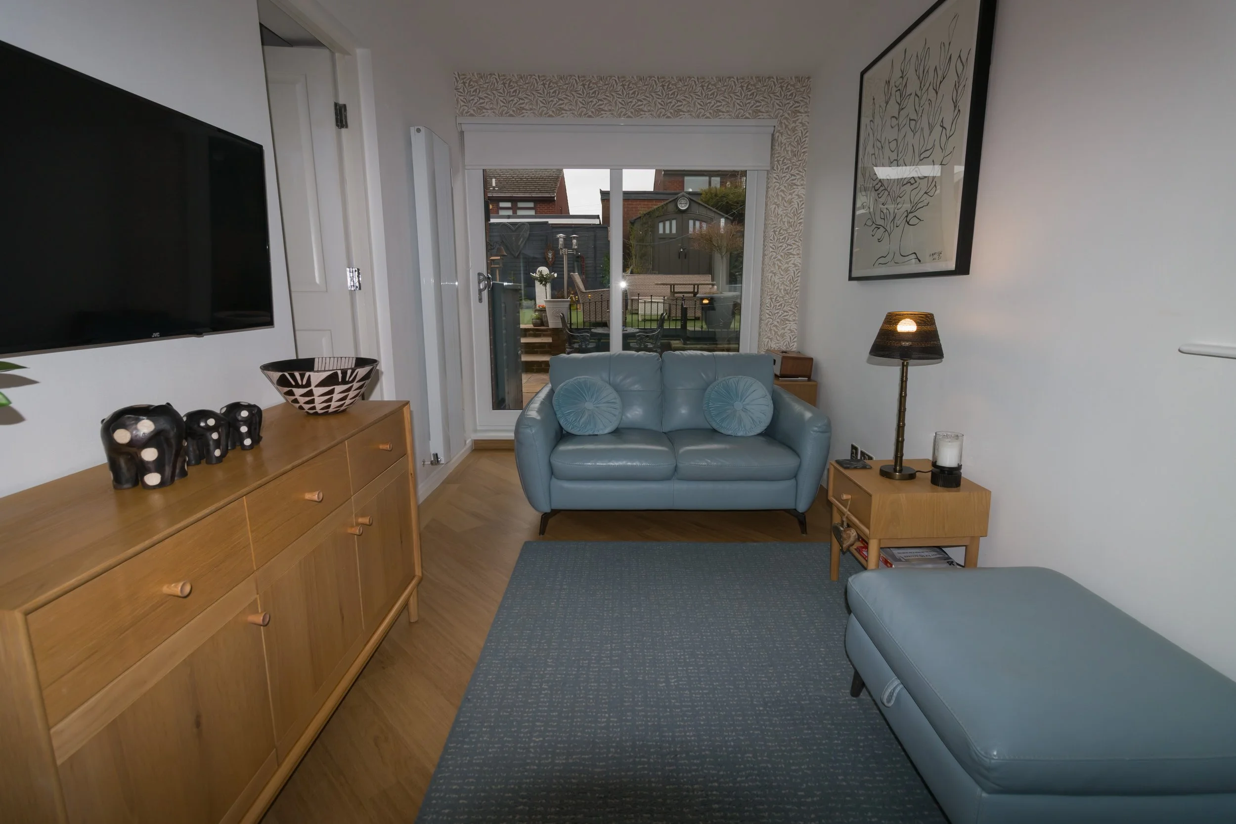 Living room before TPPS training: workable but uneven light and a loose, distracting composition