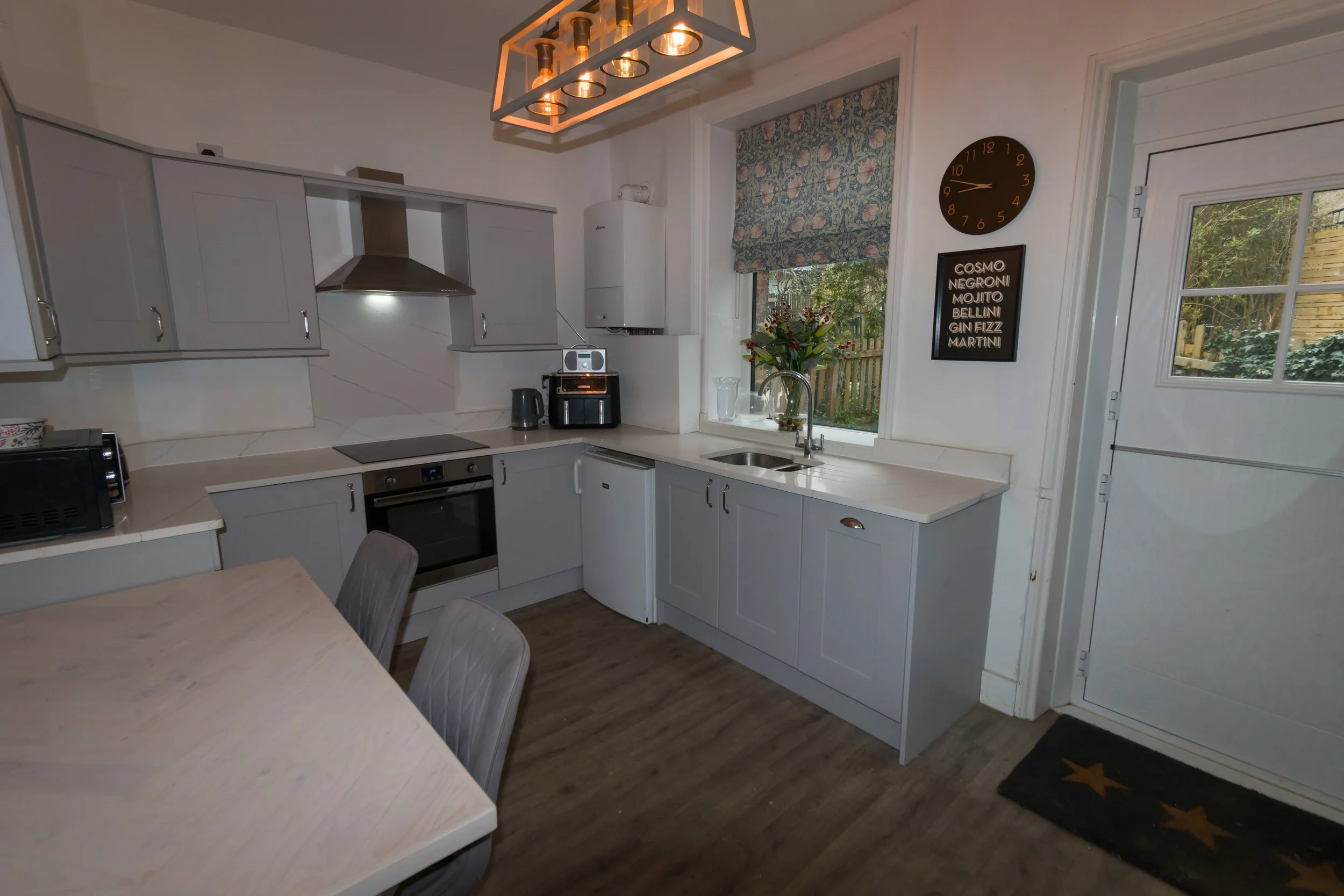 Kitchen before TPPS training: a too-wide lens choice distorting the room