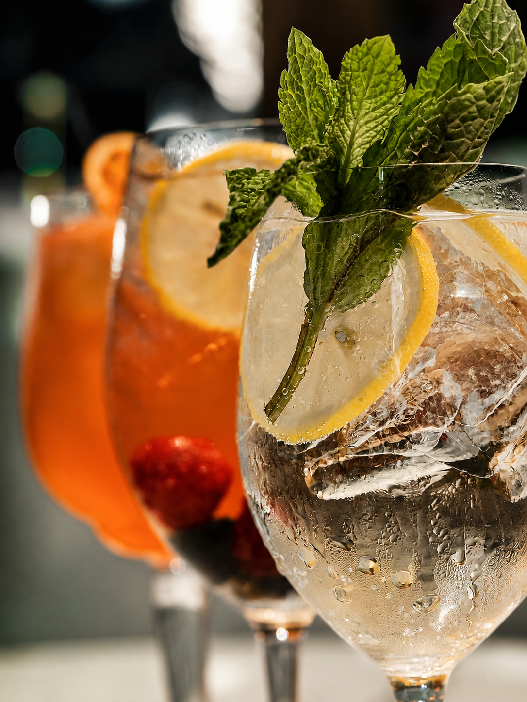 Handcrafted cocktails with citrus and mint at MCC