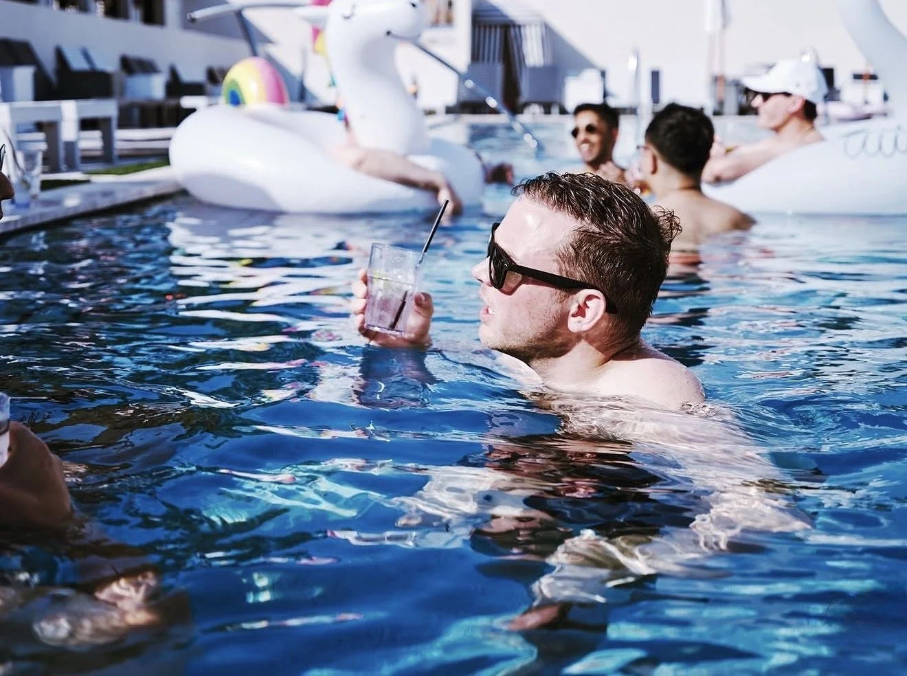 Guests enjoying the pool at The Montrose Country Club in Houston