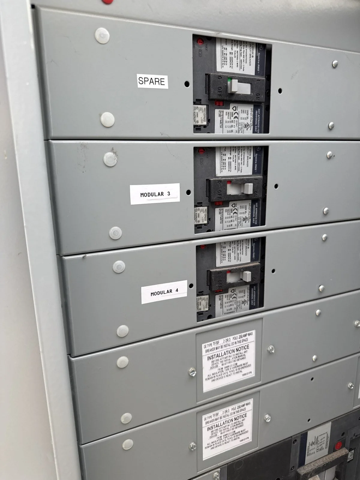 Labeled modular classroom electrical circuits at Global Village Academy Parker