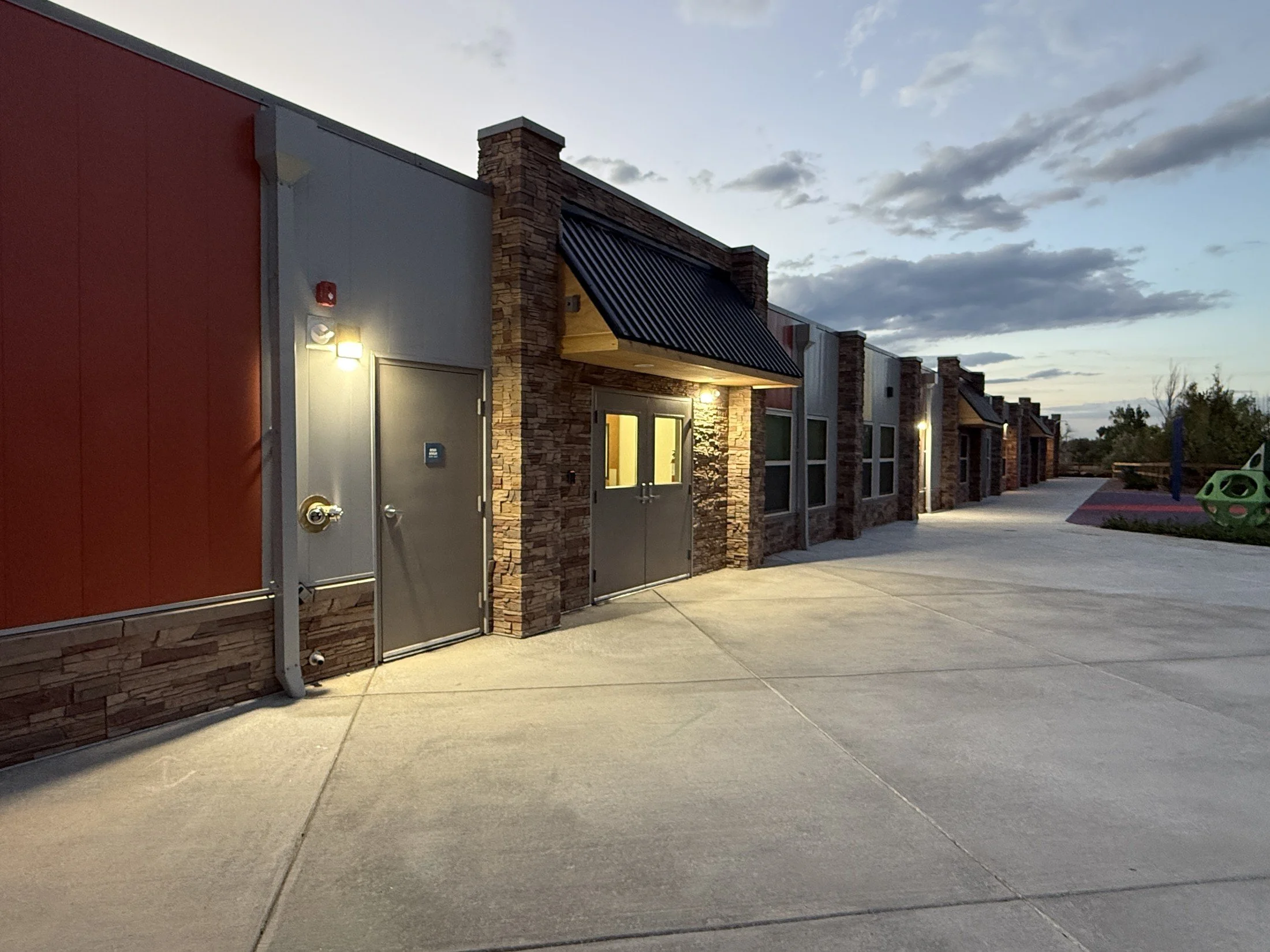 Global Village Academy Parker completed school exterior with operating walkway lighting