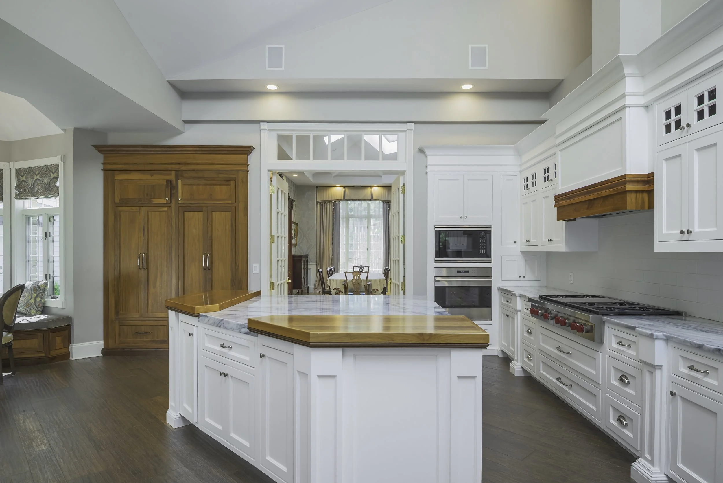 Long Island estate kitchen pass-through walnut panel — Palma Design