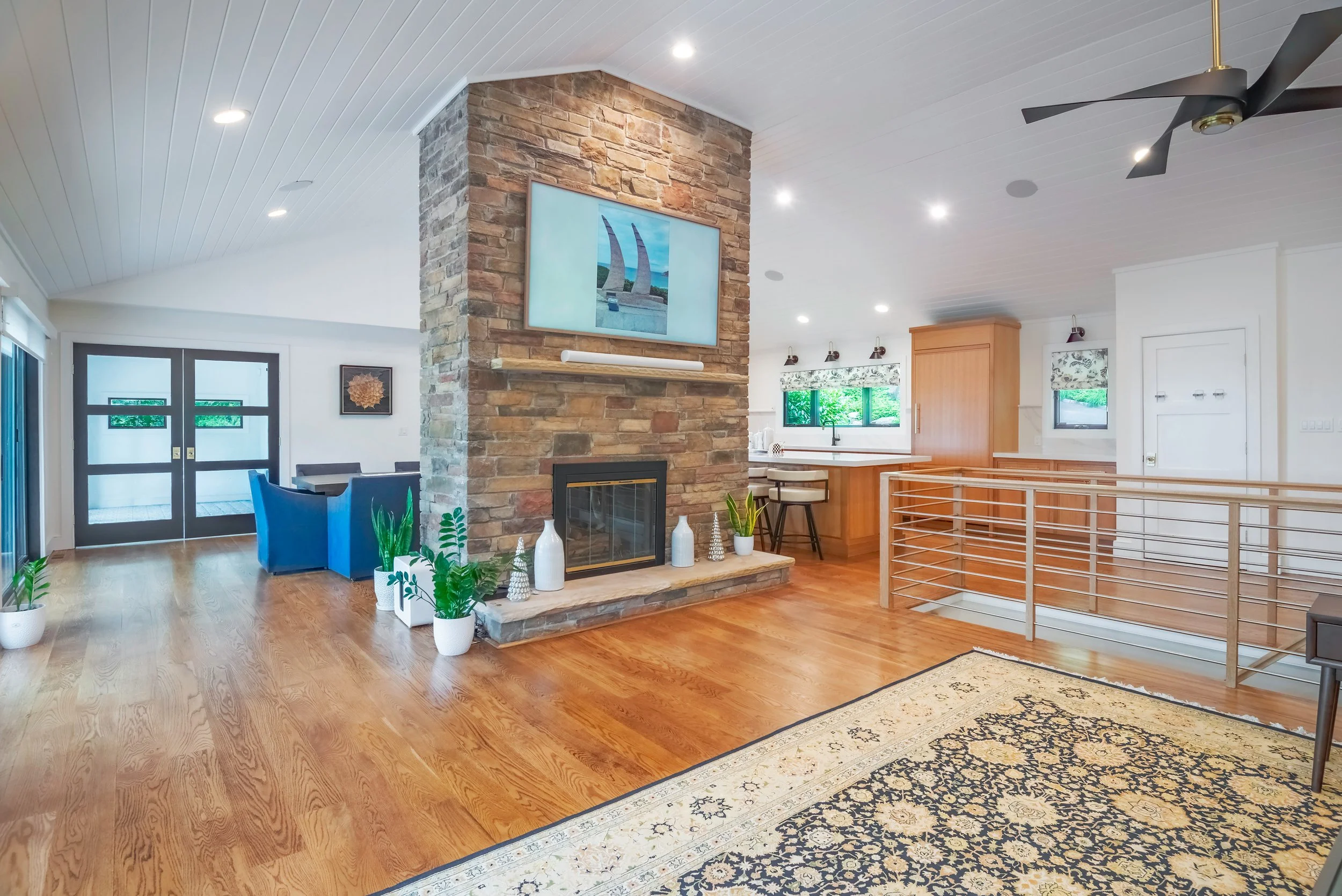 Port Jefferson renovation living room open concept stone fireplace Long Island NY — Palma Design