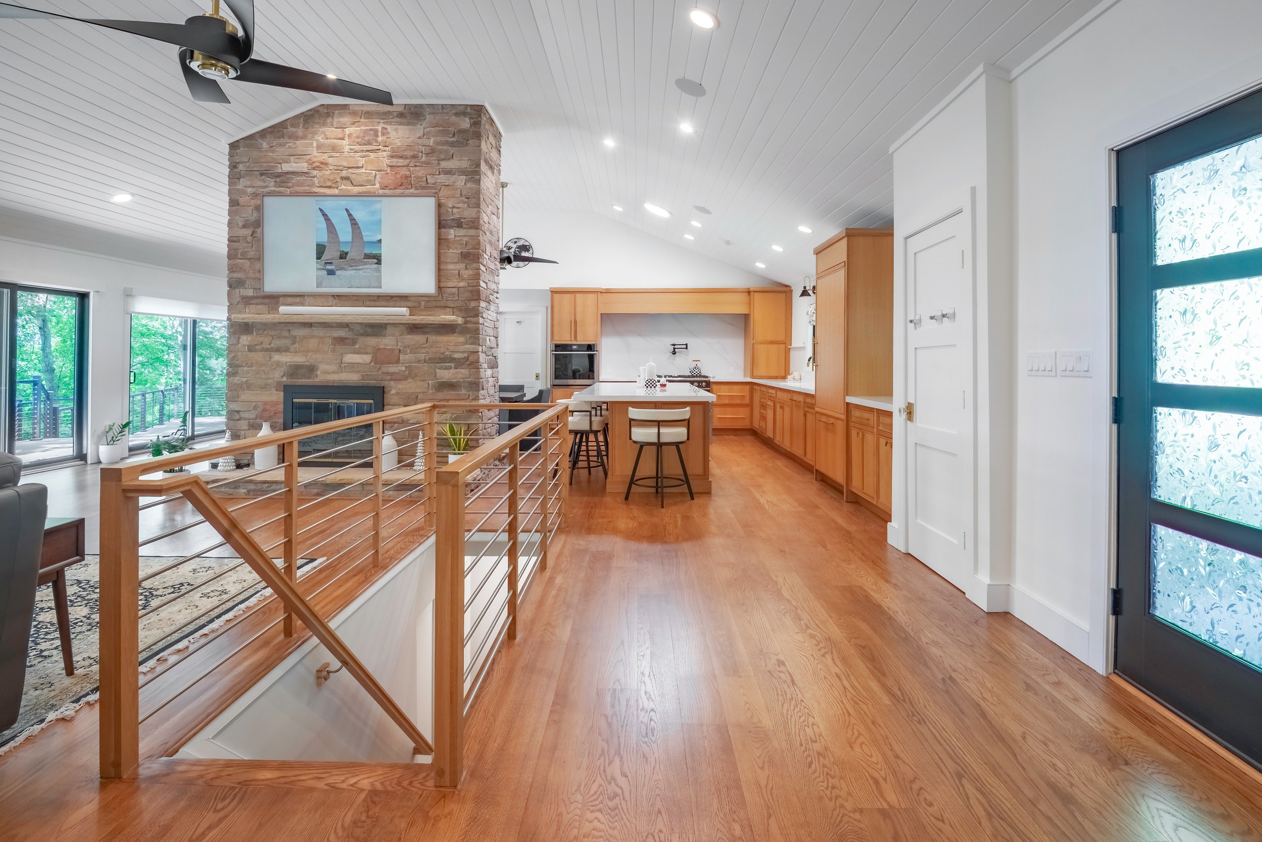 Port Jefferson renovation interior open floor plan stone fireplace Long Island NY — Palma Design