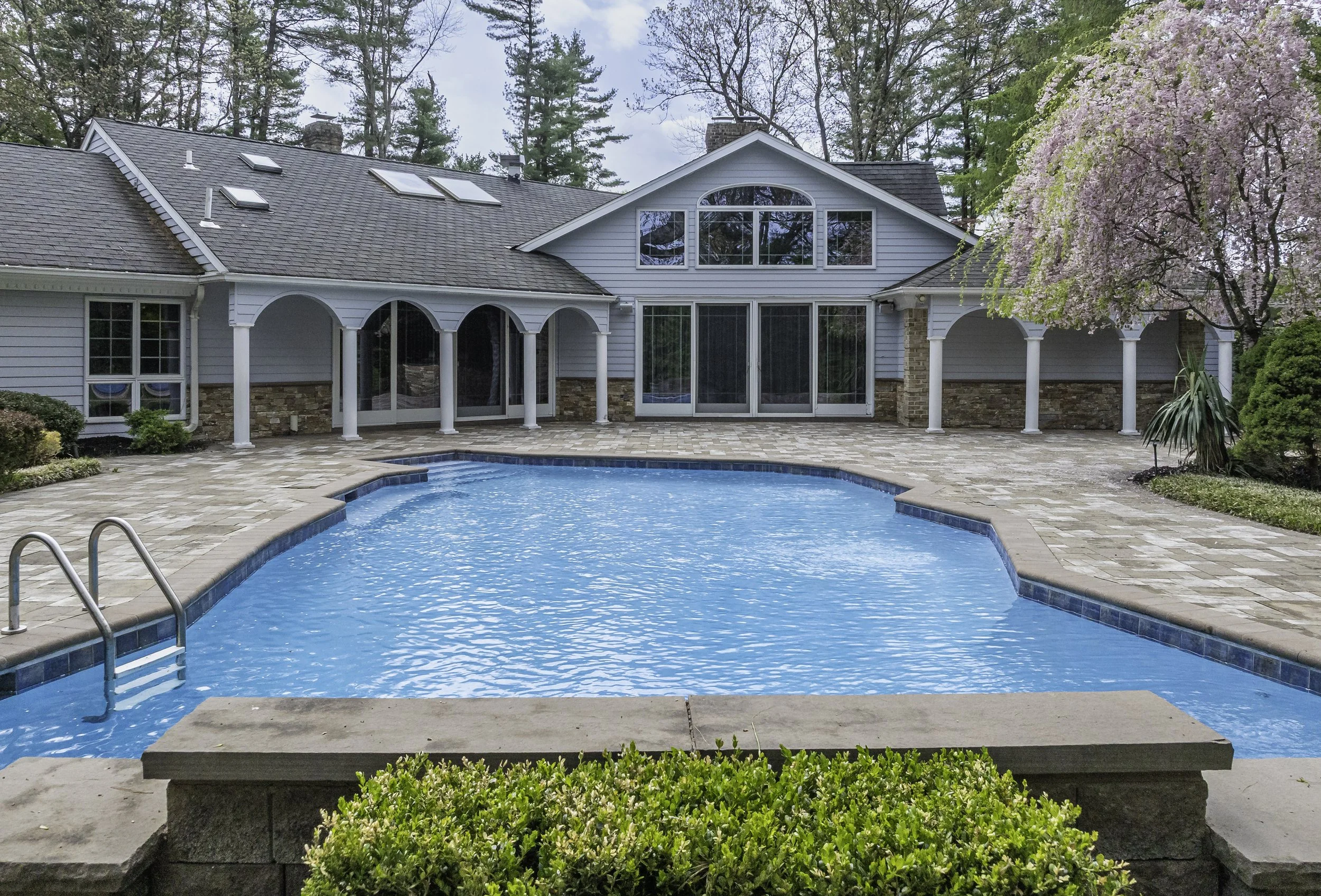 Long Island estate pool colonnade ground level — Palma Design