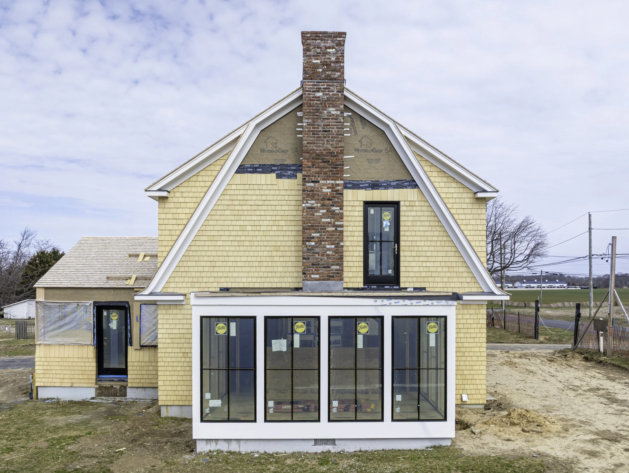 Hamptons renovation aerial drone rear elevation Long Island NY — Palma Design