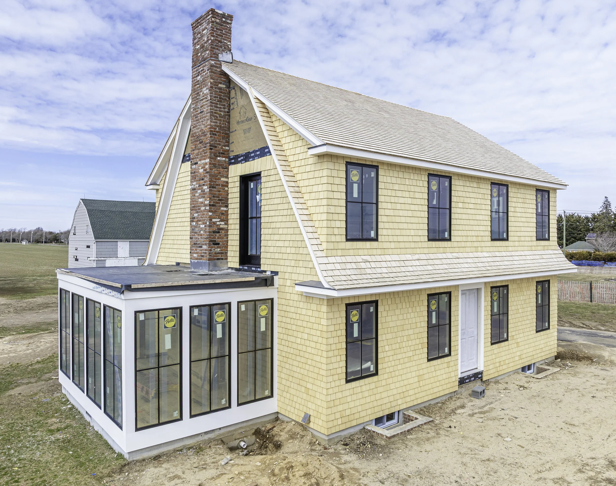 Hamptons renovation aerial drone side elevation Long Island NY — Palma Design